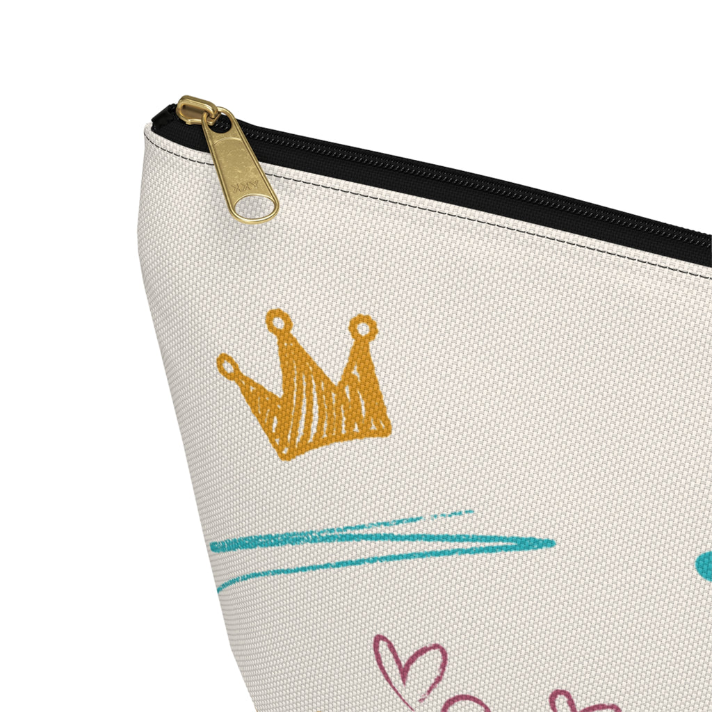 Close-up of JJ large zipper pouch showing black zipper, gold-color pull, stitching and printed fabric texture