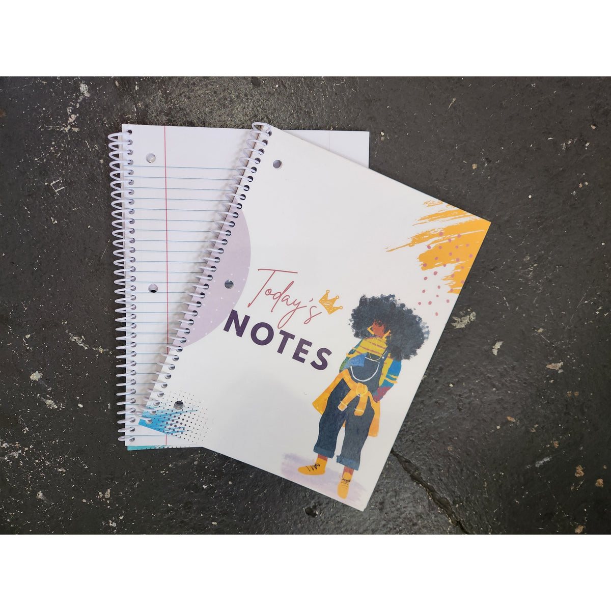 JJ spiral notebook shown open to wide ruled writing pages